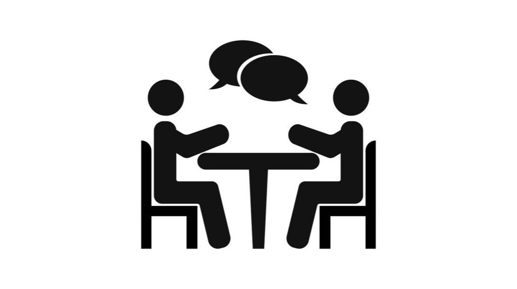 Illustration de 2 personnes discutant autour d'une table